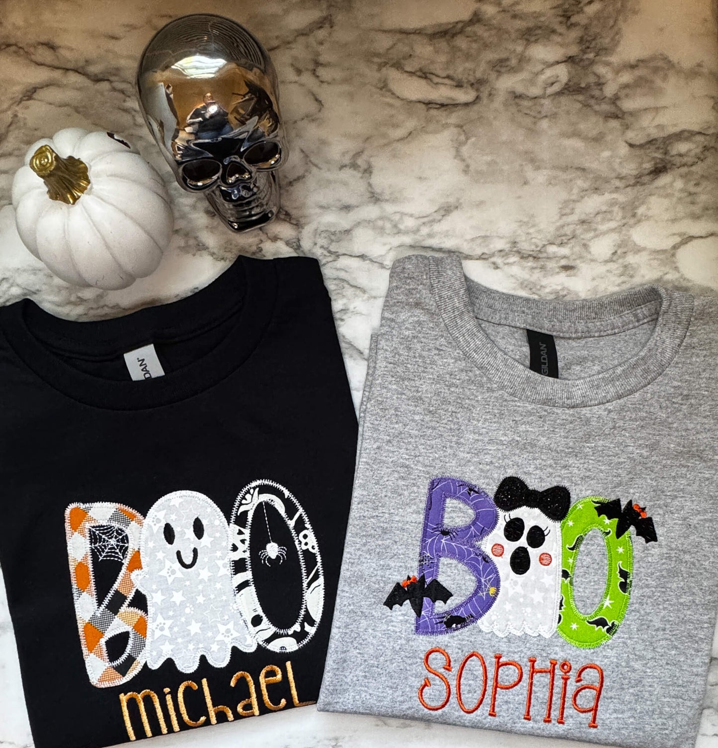 Matching Halloween t-shirts for kids with the word "Boo" embroidered on them with coordinating Halloween themed fabrics. Each shirt can be personalized with a child's name.