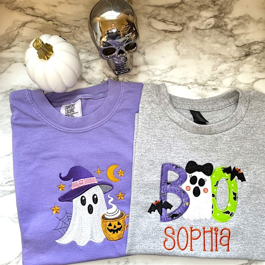 Comfort Colors Adult T-Shirt with an embroidered ghost on the color violet. Girl's Boo applique embroidered halloween design personalized with child's name on a Gildan Youth tee in the color sports gray.