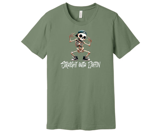 Bella Canvas T-Shirt in the color Sage with a Skeleton showing off his dance moves and the words "Straight Outta Coffin" underneath.