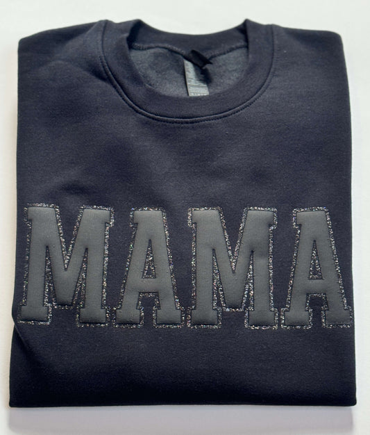Gildan Softstyle Sweatshirt in Black with a MAMA design in Black Puff HTV and outlined with black glitter HTV for a tone-on-tone look and 3D effect.