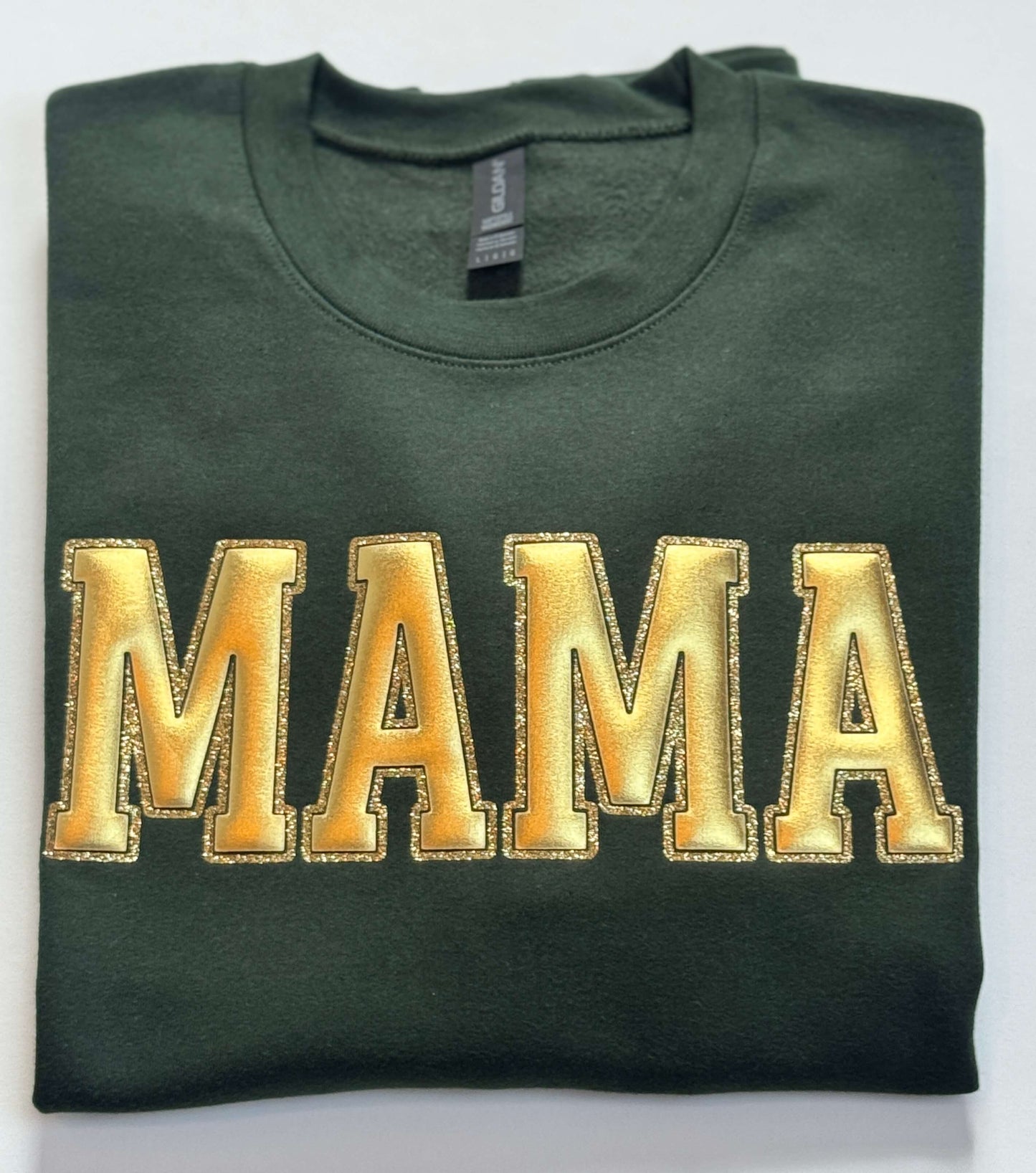 Gildan Softstyle Sweatshirt in Forest Green with a MAMA design in Gold Metallic Puff and outlined with gold glitter HTV for a 3D effect.