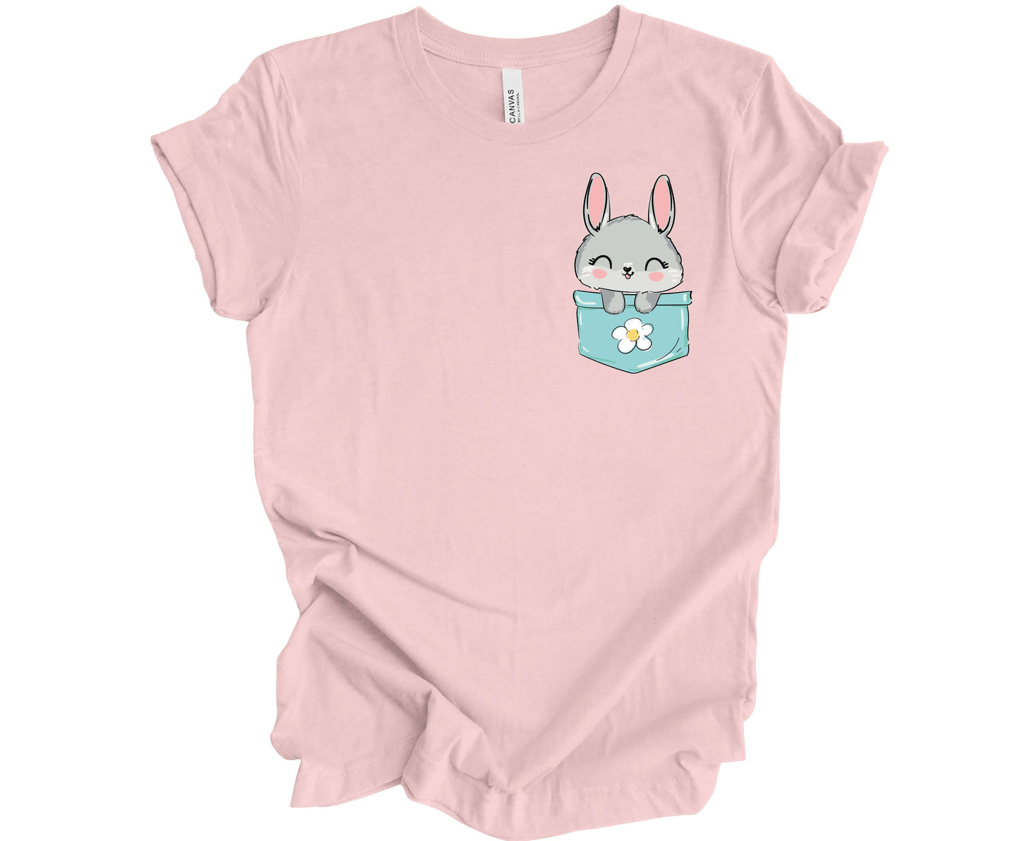 Bella Canvas T-shirt in Soft Pink with a cute Peek-a-Boo Bunny popping out of a colorful pocket.