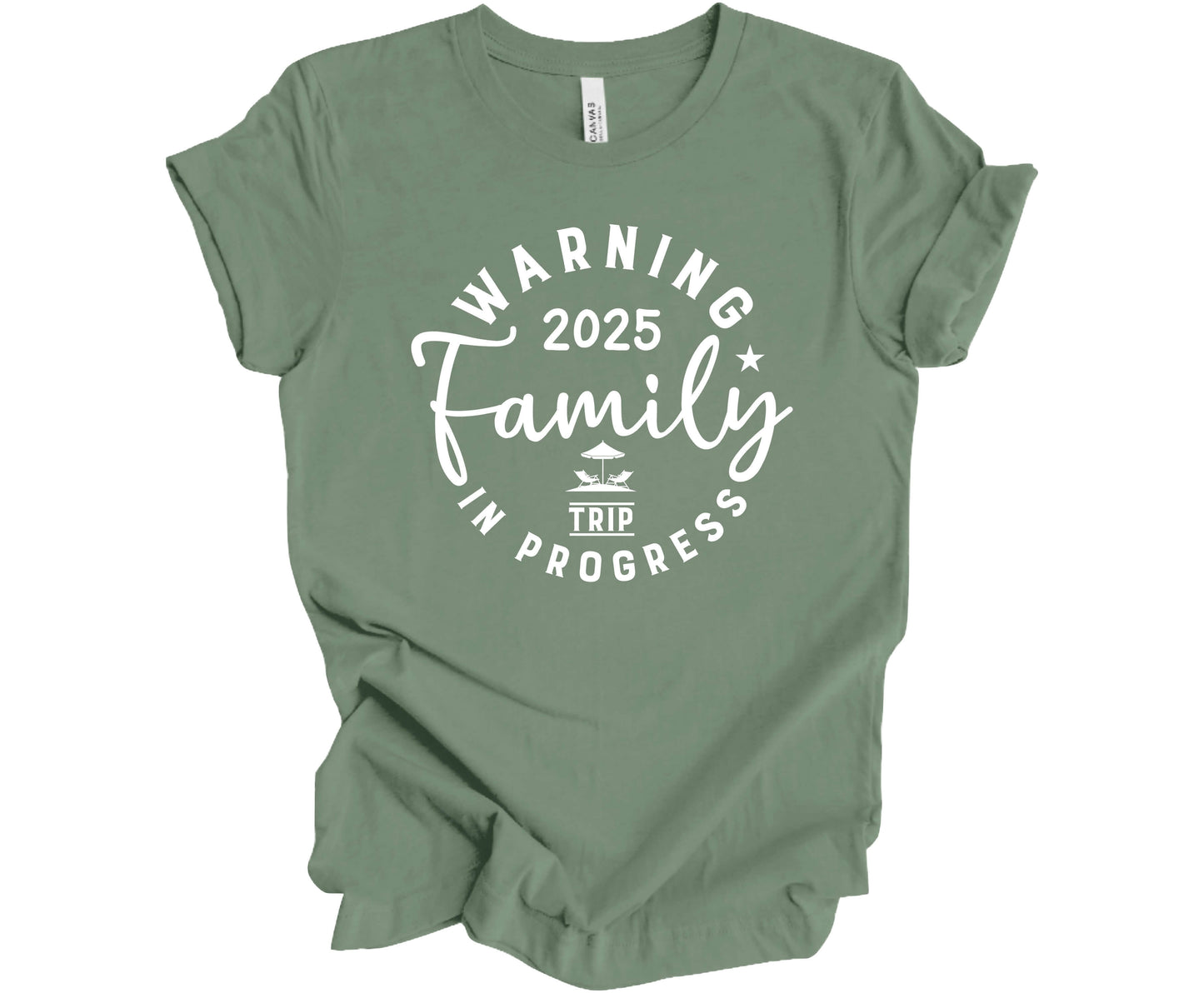 Bella Canvas T-shirt in Sage with the saying Warning Family Trip in Progress 2025