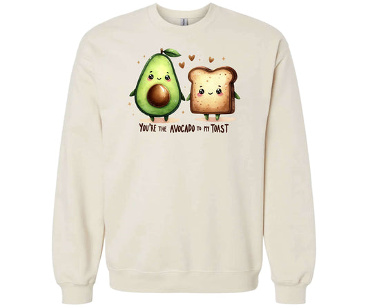 Gildan Softstyle Sweatshirt in the color Sand with a cute graphic of an Avocado and a piece of Toast and the words "You're the Avocado to my Toast".