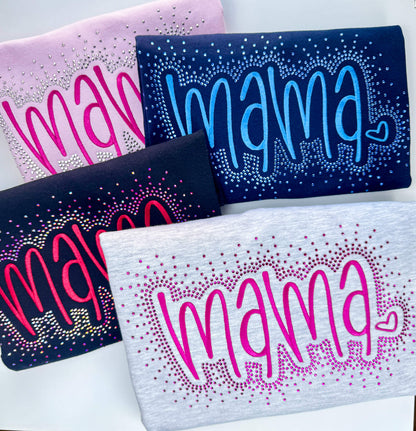 This listing is for a Gildan Softstyle Sweatshirt with the word "MAMA" embroidered in a large font.  The sweatshirt colors offered are:  1) Ash Gray with hot pink stitching, 2) Black with red stitching, 3) Lt Pink with pink stitching and 4) Navy with medium blue stitching.  Each shirt comes with the option of adding a rhinestone splatter around the embroidery in a complimentary color.  This image shows each color offered with the rhinestone splatter.