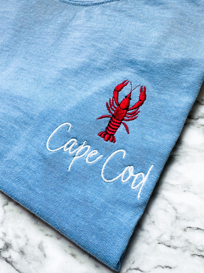 Close-up of the embroidered lobster on a Comfort Colors t-shirt, showcasing premium embroidery detail and personalized with the words Cape Cod.