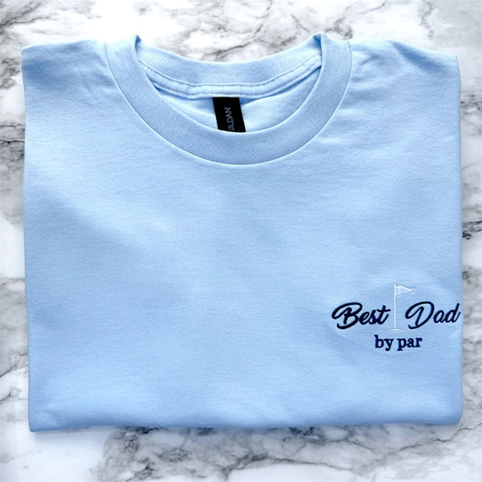 Gildan Light Blue T-Shirt with a left chest embroidered design that says: "Best Dad by Par" with a golf flag.