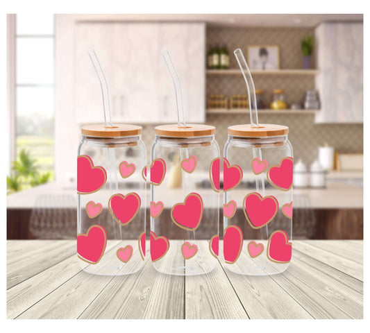 Glass Tumbler (16oz) decorated with cute large raspberry pink hearts and smaller pink hearts.  Tumbler comes with a wooden lid and a reusable straw.