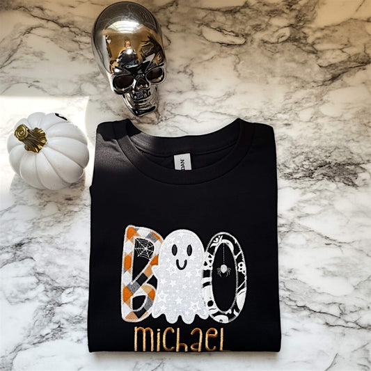 Black Gildan Personalized Halloween T-Shirt with the word "BOO"  embroidered with a cute ghost replacing one of the "O"s in the design.  Name of child embroidered underneath the design. 