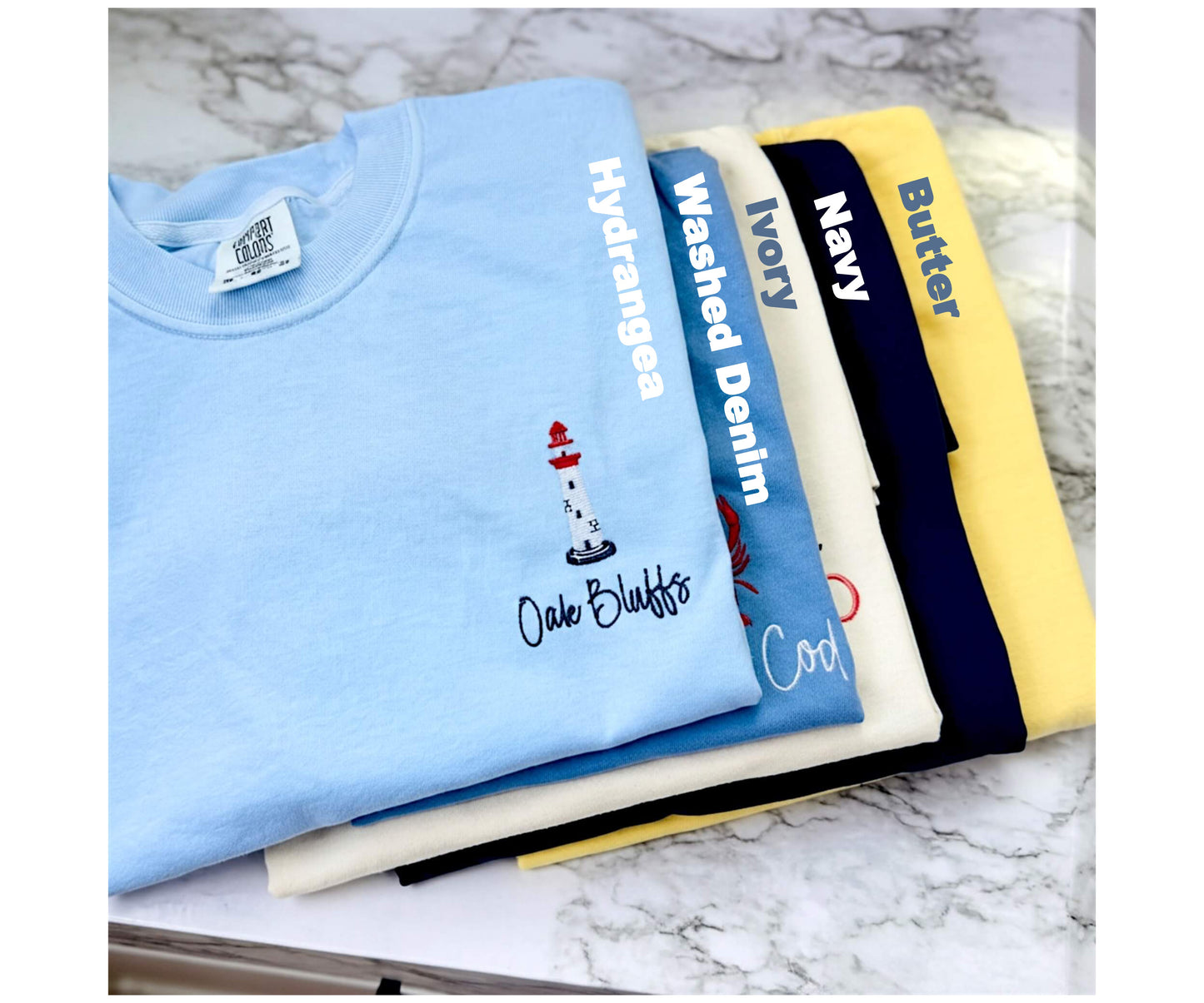 Five coastal-inspired Comfort Colors t-shirt colors available for our Coastal Collection: Hydrangea, Washed Denim, Ivory, Navy, and Butter.