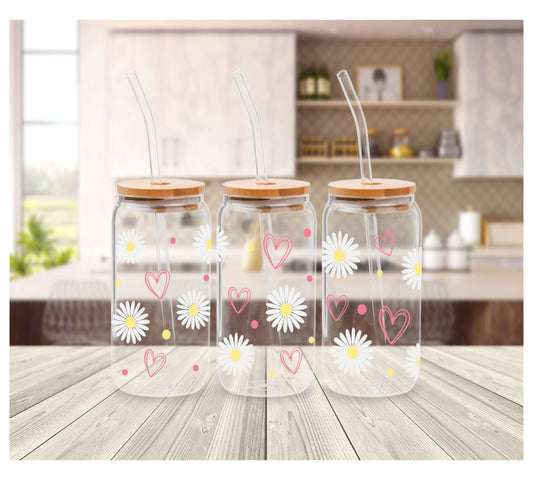 Glass Tumbler (16oz) decorated with cute white daisies and pink hearts.  Tumbler comes with a wooden lid and a reusable straw.