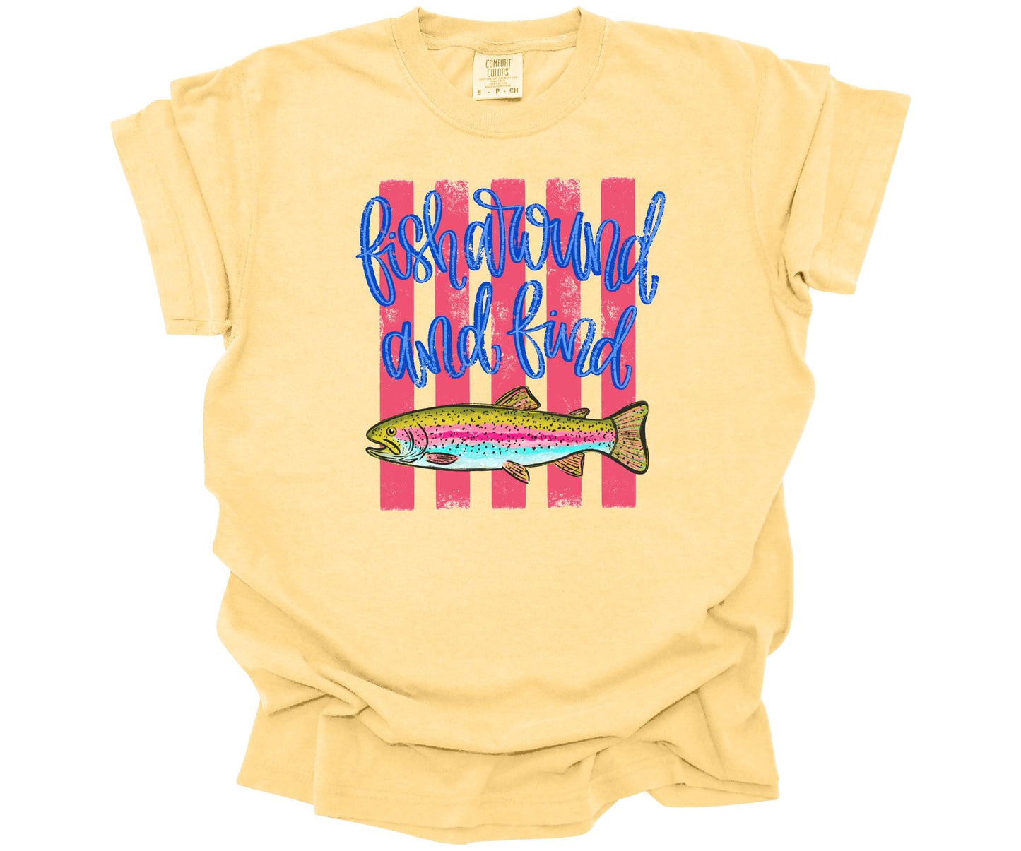 Hand-drawn trout fish graphic with hot pink horizontal lines and script text saying: "Fish Around and Find Trout" on a premium Comfort Colors T-shirt in the color Butter.