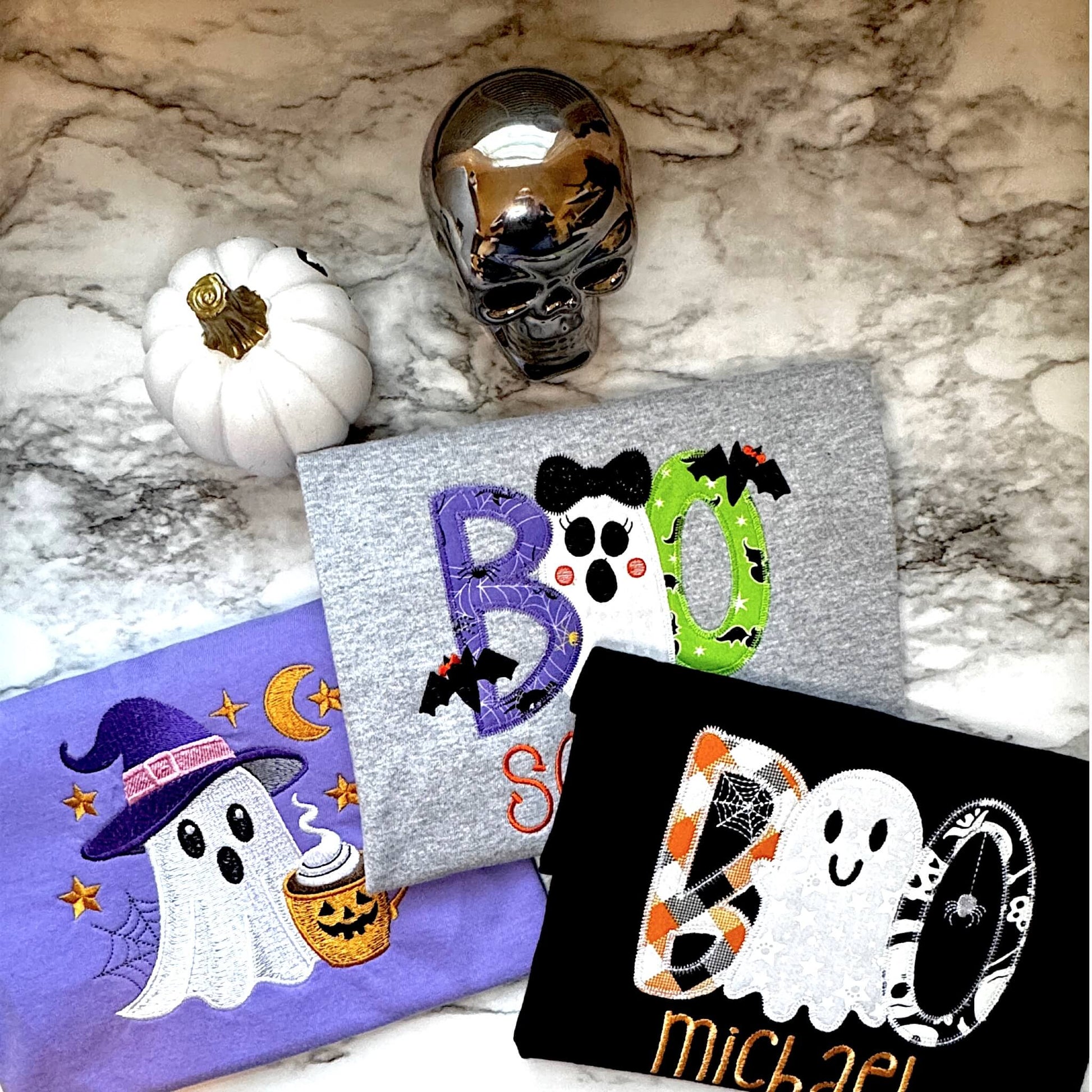 Halloween themed embroidered Tshirts for mom and kids.  All part of the Fall and Halloween Collection.  Adult Comfort Colors tee in the color Violet is all embroidered.  Kids shirt are Gildan with applique embroidered designs which can be personalized with child's name.