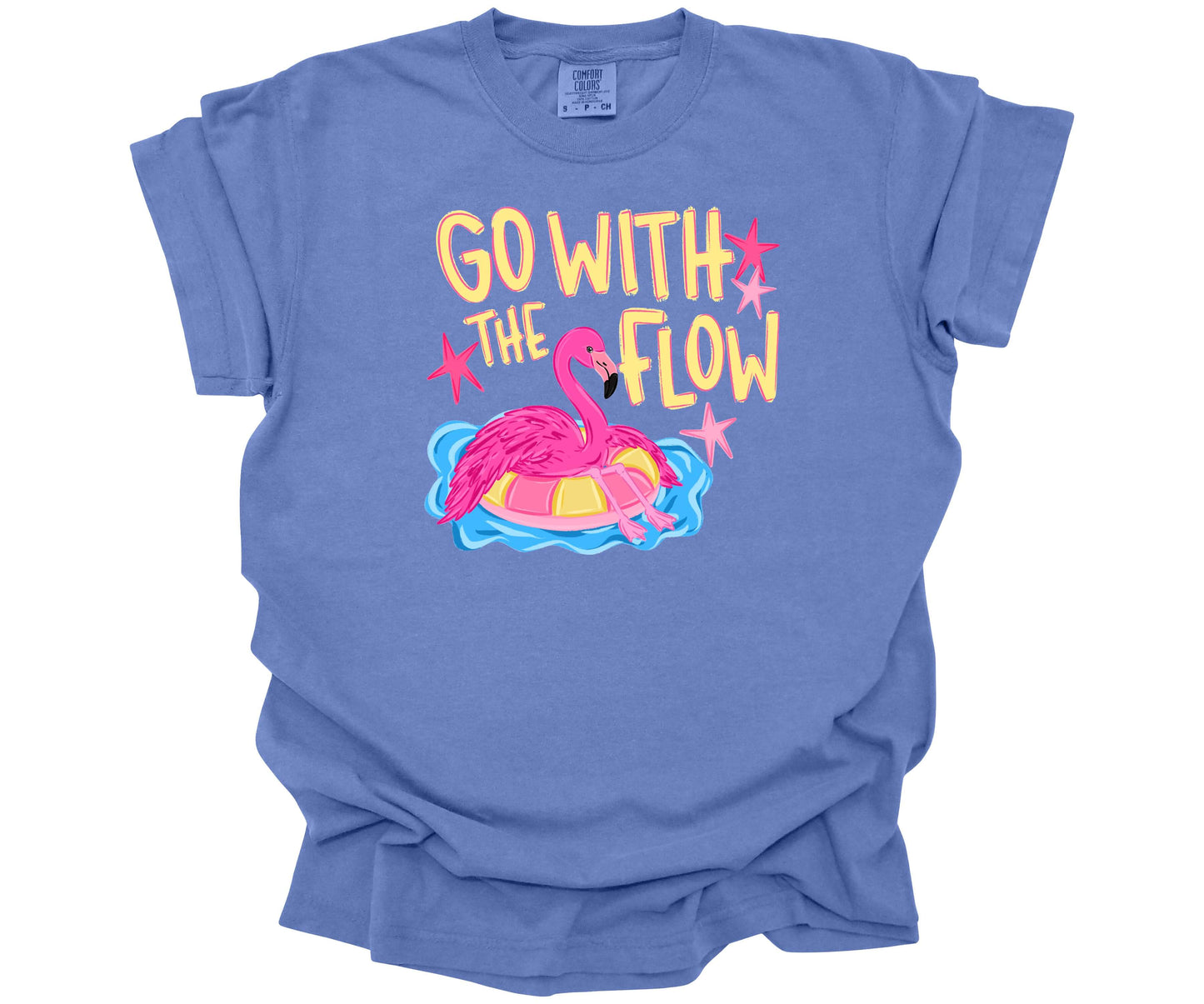 Comfort Colors T-Shirt in the color Mystic Blue with a cute design that shows a hot pink flamingo hanging out on a pool floaty with the words "Go with the Flow" across the top.  Perfect for summer.