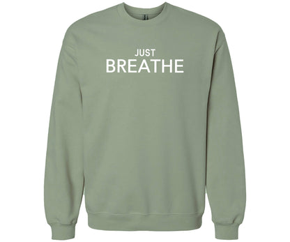 Gildan Softstyle Sweatshirt in the color Sage with the words "Just Breathe" across the front of the shirt. 