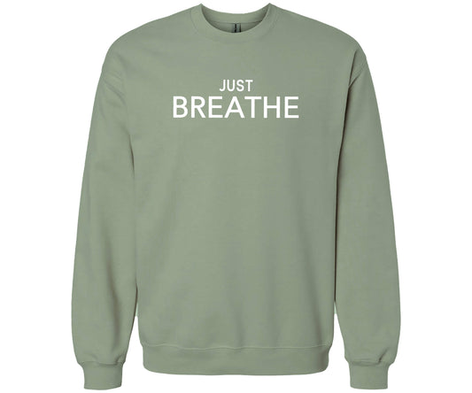 Gildan Softstyle Sweatshirt in the color Sage with the words "Just Breathe" across the front of the shirt. 