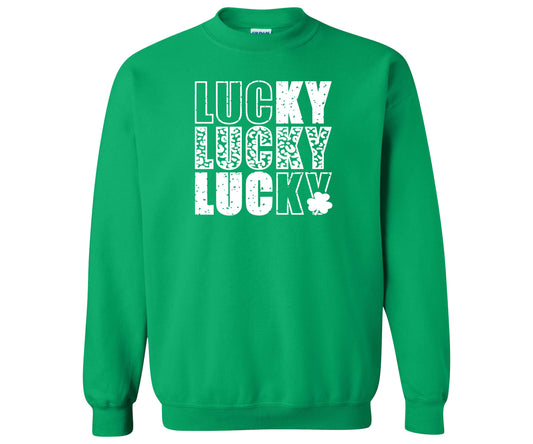 Gildan Heavy Blend Sweatshirt in the color Irish Green with a Lucky Design in all white that repeats itself three times.  The font used gives a distressed look to the design.