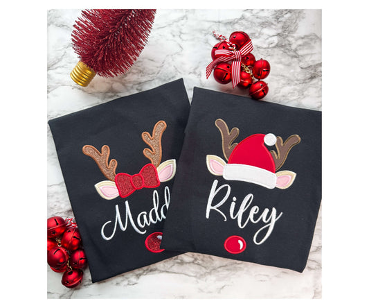 Family Christmas Matching Black Shirts showcasing an embroidered cute reindeer face design with either a girl or boy reindeer design.  Each shirt can be personalized with your name.  Perfect for photos or Christmas morning.
