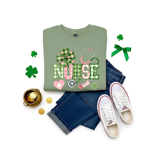 Gildan Softstyle sweatshirt in the color Sage featuring a plaid “NURSE” design with shamrock, stethoscope, and other medical accents.