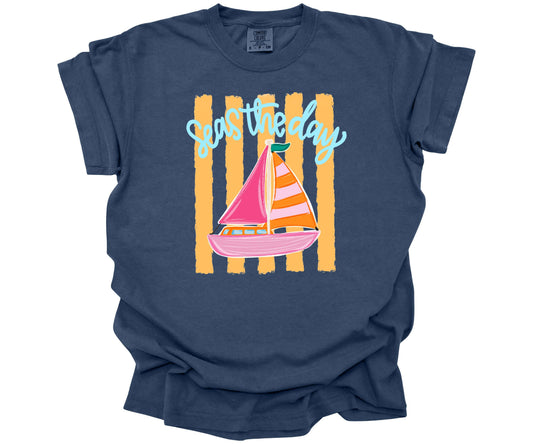 Inspirational "Seas the Day" graphic design with a hand-drawn sailboat on yellow horizontal stripes on a Comfort Colors Tee in the color China Blue.