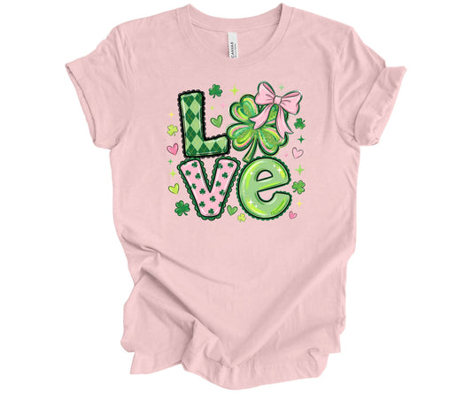 Bella Canvas T-shirt in soft pink with a St Patrick’s Day LOVE shamrock bow design.