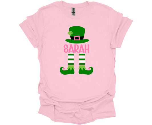 Gildan Softstyle T-Shirt in Light Pink with a St. Patrick's Day Elf design that can be personalized with your name.