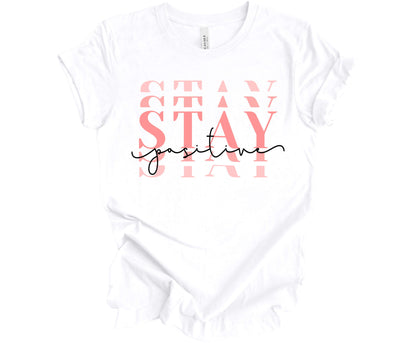 Bella Canvas T-Shirt in White with the word Stay (Stacked) and the word Positive across it.