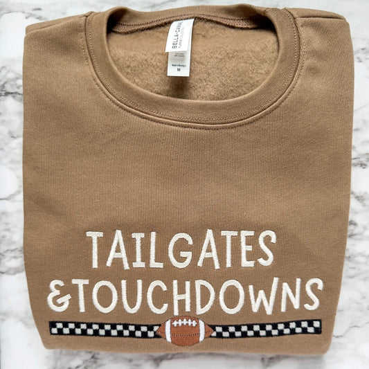 Embroidered Bella Canvas 3945 football sweatshirt in Vintage Brown with Tailgates & Touchdowns design with racing stripe and football underneath.