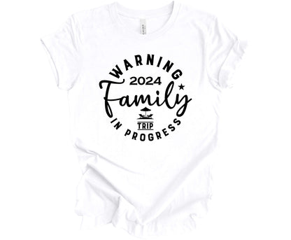 Bella Canvas T-shirt in White with the saying Warning Family Trip in Progress 2024