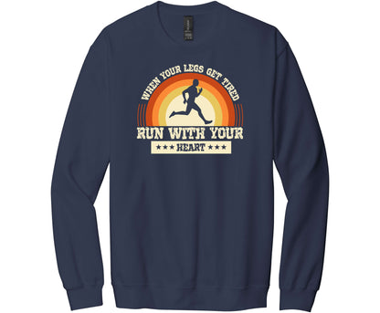 Gildan Softstyle Navy Sweatshirt with a graphic of a Runner and the words When Your Legs Get Tired Run With Your Heart