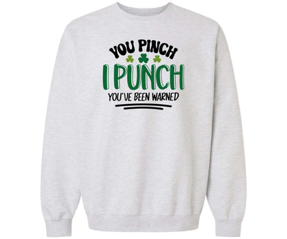 Gildan Softstyle Ash Gray Sweatshirt with the design You Pinch, I Punch You've Been Warned on it for St. Patrick's Day.